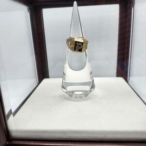 Black enamel and 18k gold plated with letter "P" in gold.  Marked in.  Playboy?